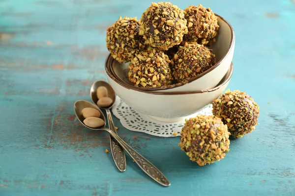 Tasty homemade pistachio candies on wooden table — Stock Photo, Image