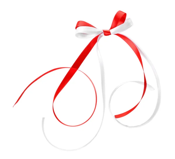 Colorful red and white ribbons with bow isolated on white — Stock Photo, Image