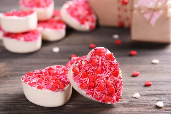 Delicious chocolate candies in heart shape — Stock Photo, Image