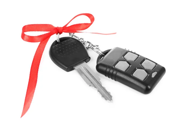 Car keys with red bow as present isolated on white — Stock Photo, Image