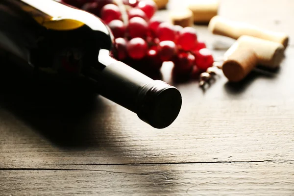 Glass bottle of wine with corks — Stock Photo, Image