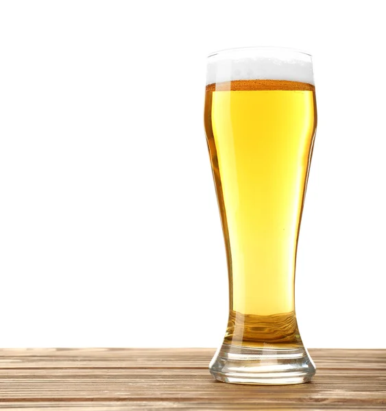 Glass of beer on wooden table, isolated on white — Stock Photo, Image