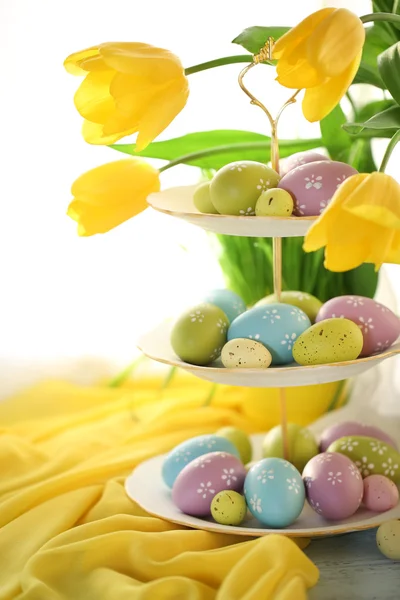 Easter eggs on vase and tulips — Stock Photo, Image