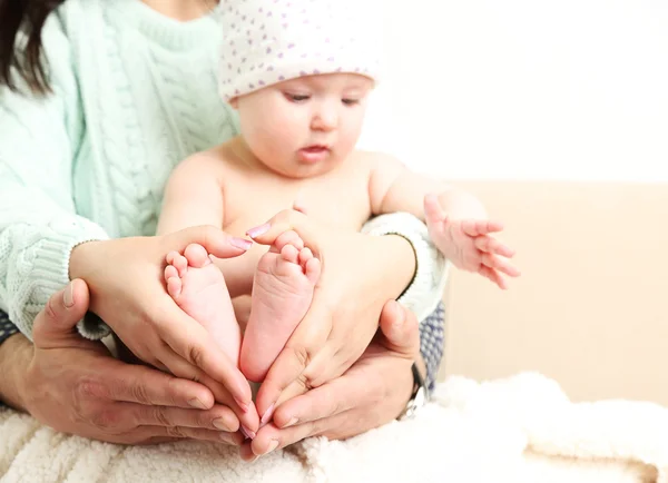 Newborn baby on father and mother hands, close-up — Stock Photo, Image