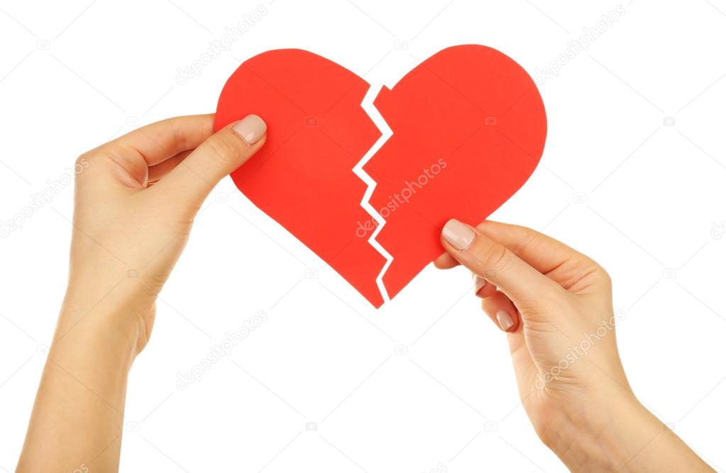 Female hands holding broken heart isolated on white