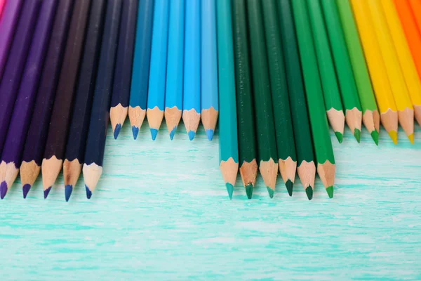 Colorful pencils on wooden table — Stock Photo, Image