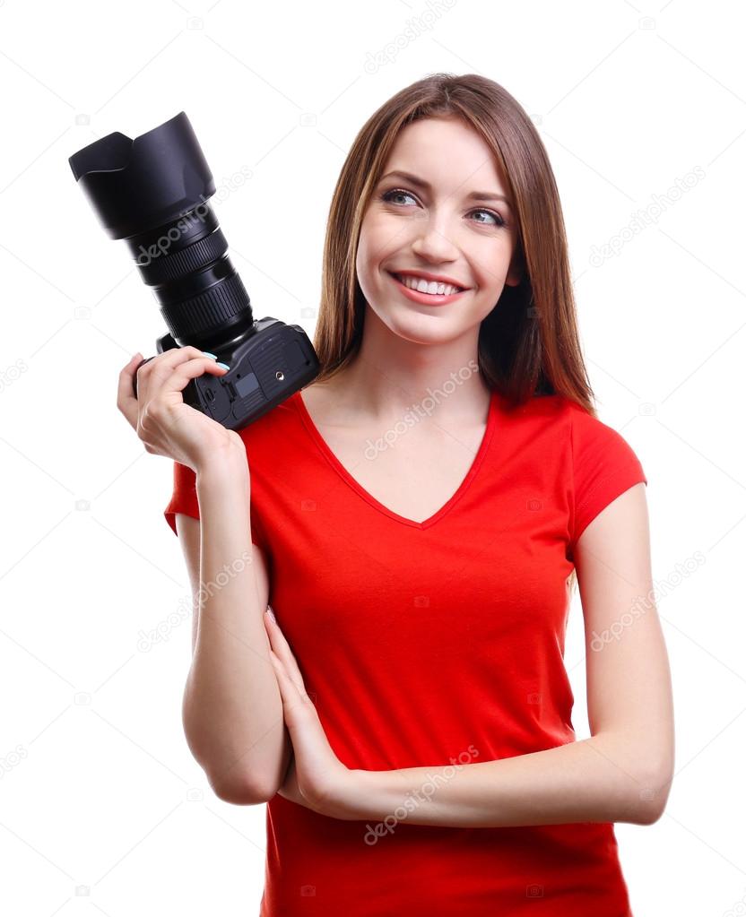 Young female photographer taking photos isolated on white