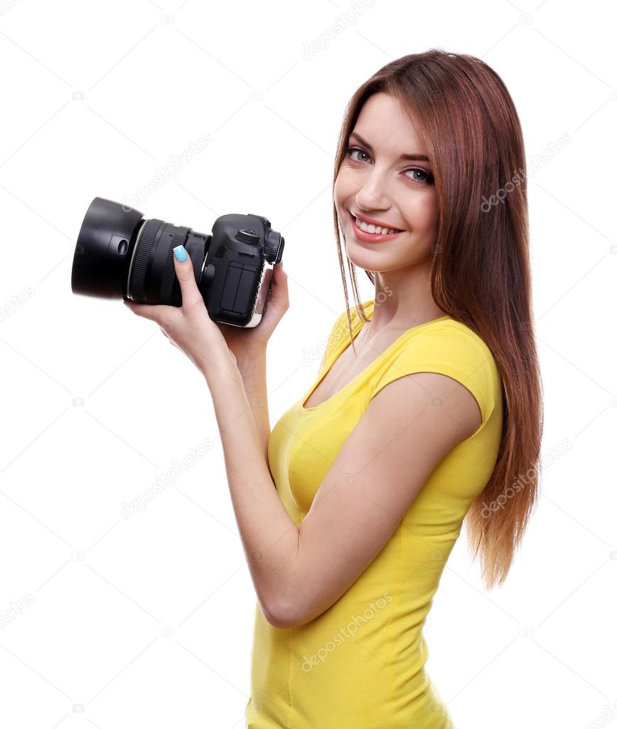 Young female photographer taking photos isolated on white