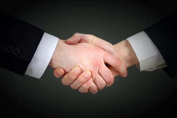 Business handshake on gray background — Stock Photo, Image