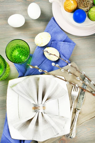 Easter table setting on color wooden background — Stock Photo, Image