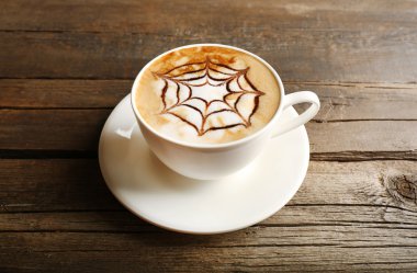 latte sanat ahşap arka plan üzerinde kahve fincan