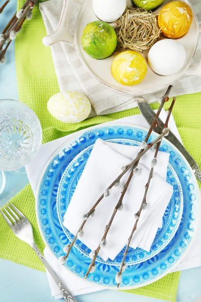 Easter table setting on color wooden background — Stock Photo, Image