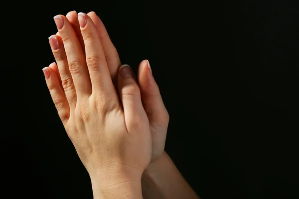 Woman praying in darkness — Stock Photo, Image