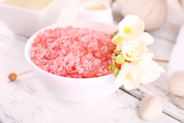 Spa still life with color sea salt on wooden table, closeup — Stock Photo, Image