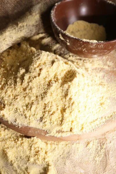 Whole flour with bowl and sieve on wooden cutting board, closeup — Stock Photo, Image