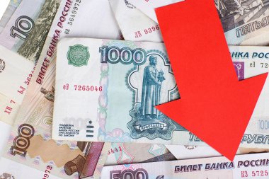 Red arrow on Russian money as depreciation of currency, closeup clipart