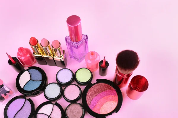 Set of decorative cosmetics on light colorful background — Stock Photo, Image