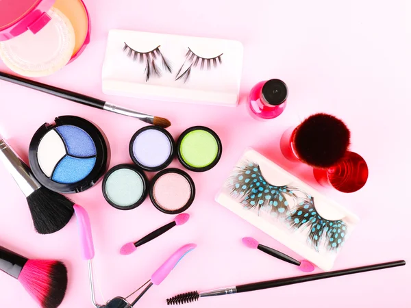 Set of decorative cosmetics on light colorful background — Stock Photo, Image