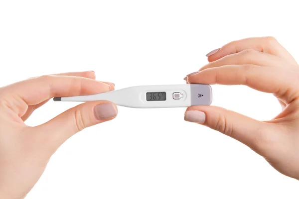 Frauenhände halten Thermometer isoliert auf weiß — Stockfoto