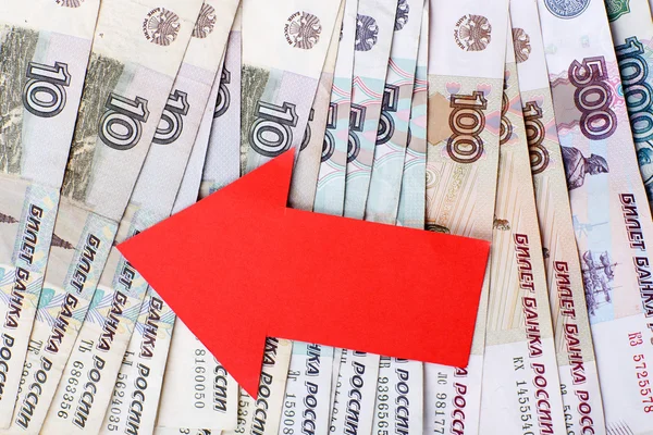 Red arrow on Russian money as depreciation of currency, closeup — Stock Photo, Image