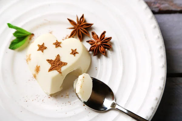 Tasty panna cotta dessert on plate, close up — Stock Photo, Image