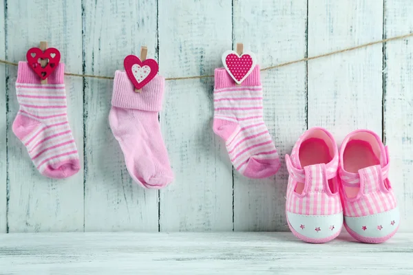 Cute toddler shoes on wooden background — Stok fotoğraf