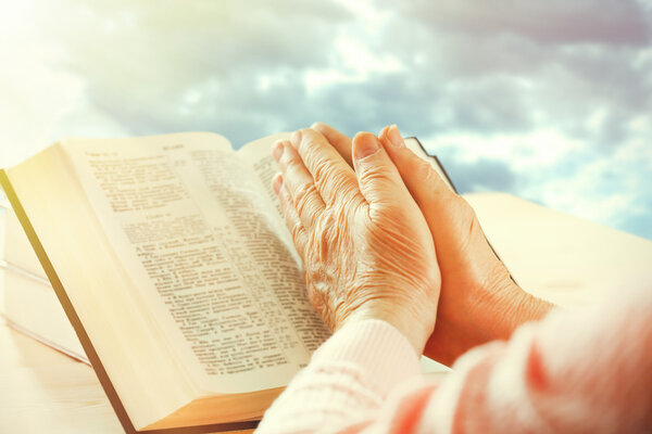 Human hands on sky background