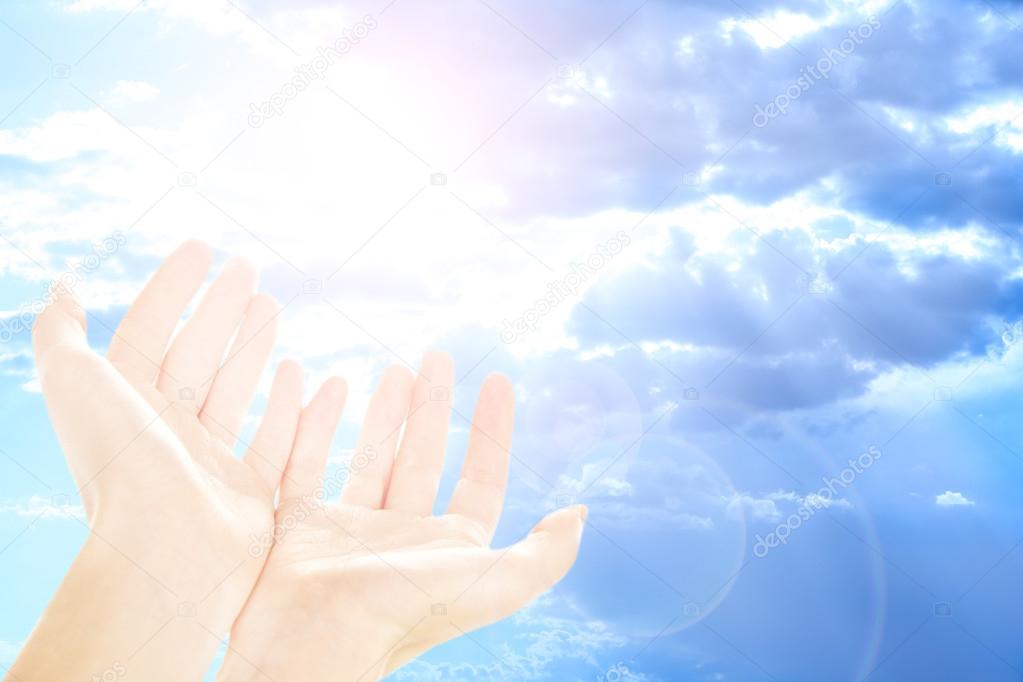 Human hands on sky background
