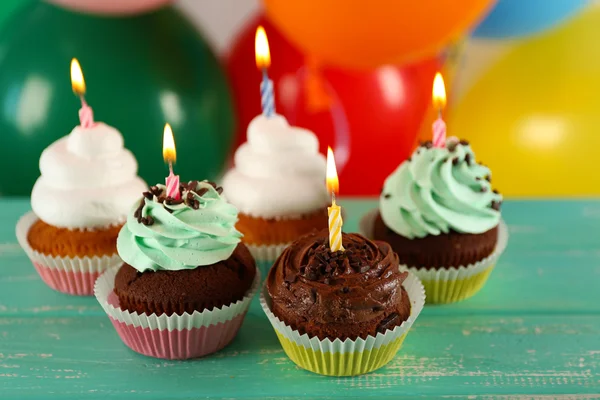 Delicious birthday cupcakes on table on bright background — Stock Photo, Image