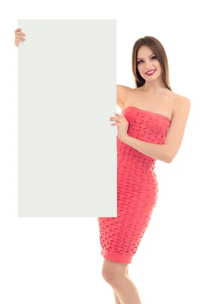 Modelo bonito no vestido com cartaz em branco isolado no branco — Fotografia de Stock