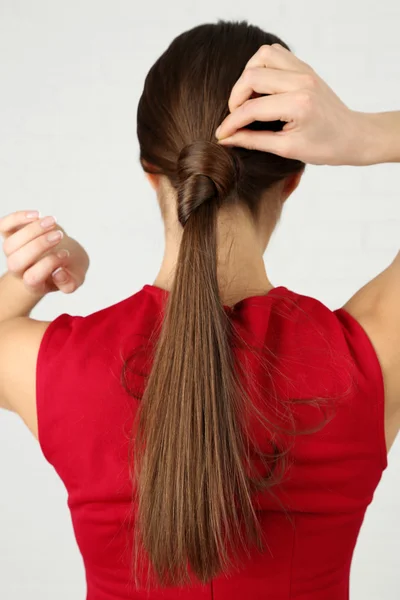 Female hairstyle on light background — Stock Photo, Image