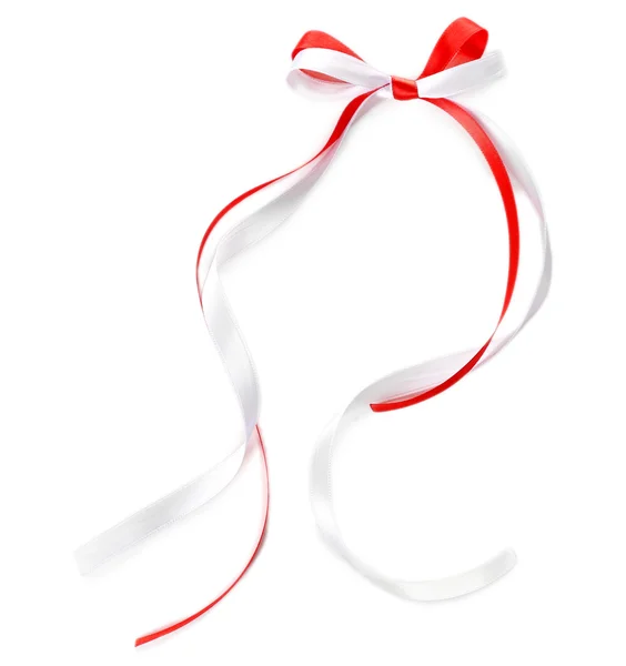 Colorful red and white ribbons with bow isolated on white — Stock Photo, Image