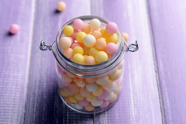 Colorful sprinkles on jar on table close-up — Stock Photo, Image