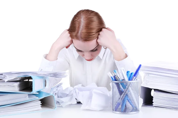Tired woman at her workplace with documents isolated on white — Stock Photo, Image