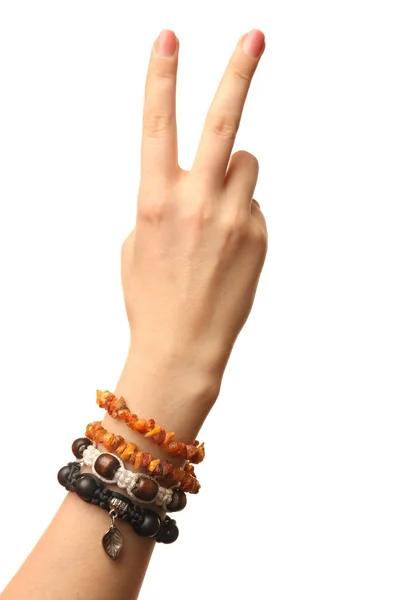 Ženská ruka s náramky izolovaných na bílém — Stock fotografie
