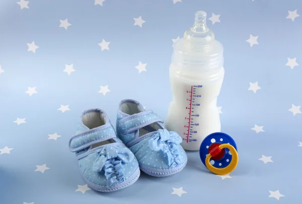 Baby shoes on blue background — Stock Photo, Image