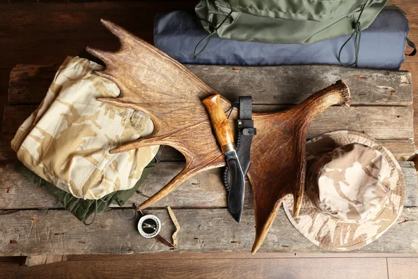 Hunting gear on wooden board, top view — Stock Photo, Image