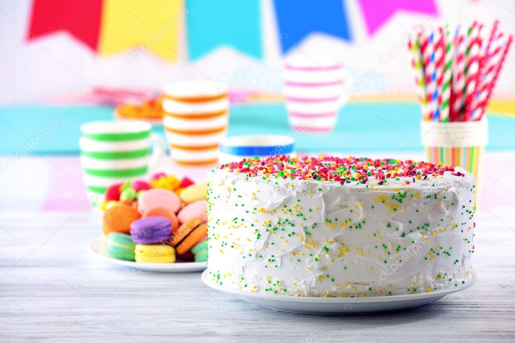 Birthday cake on colorful background