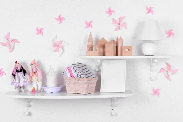 Baby accessories on shelves close-up — Stock Image Baby accessories on shelves close-up Stock Photo