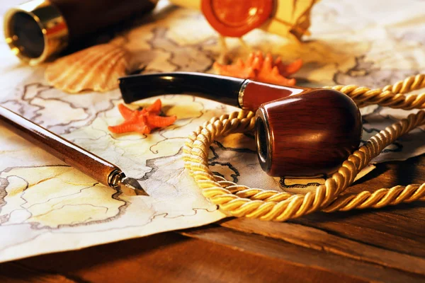 Marine still life with world map on wooden table background — Stock Photo, Image