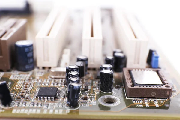 Computer motherboard on white background, macro view — Stock Photo, Image