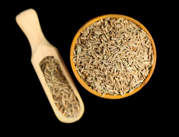Cumin in wooden bowl — Stock Photo, Image