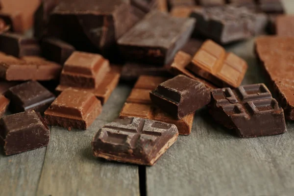 Set of chocolate on wooden table, closeup — Stock Photo, Image