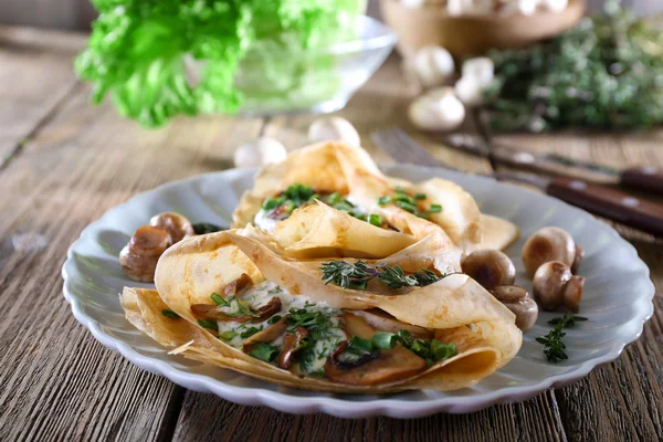 Pancakes with creamy mushrooms — Stock Photo, Image