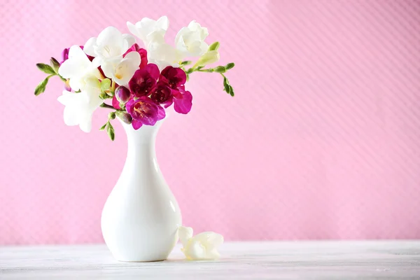 Beautiful spring flowers on pink background — Stock Photo, Image