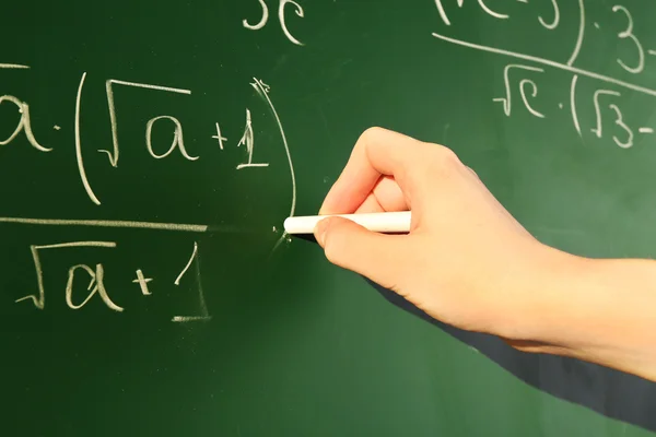 Teacher hand writing formulas — Stock Photo, Image