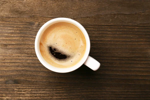 Taza de café sobre mesa de madera —  Fotos de Stock