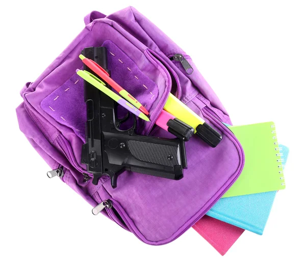 Gun in school backpack — Stock Photo, Image