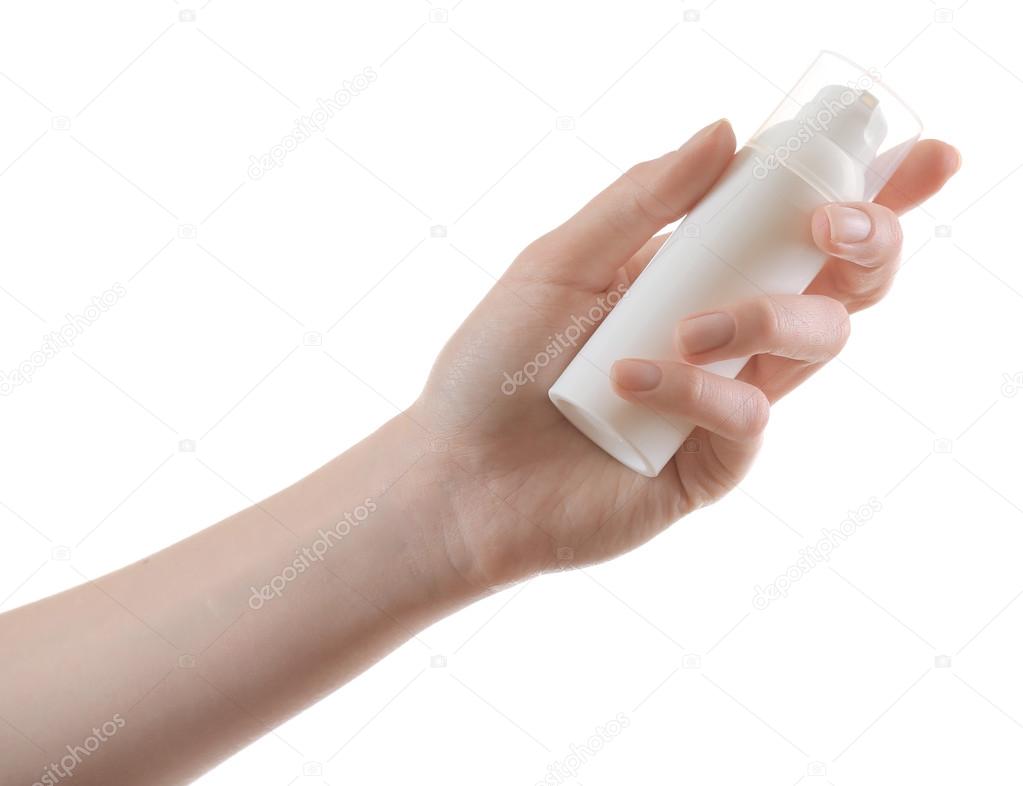 Hand with cosmetics bottle