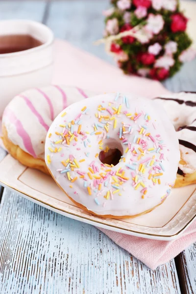 Delicious donuts with icing — Stock Photo, Image